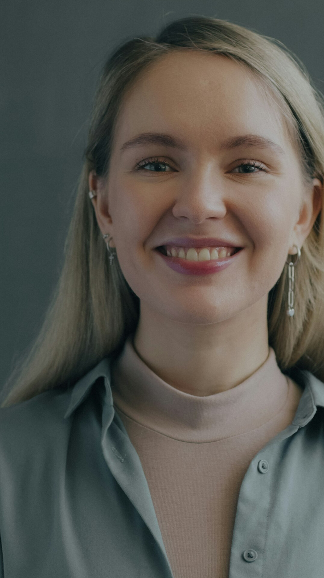 Studio portrait of a woman consultant smiling at the camera