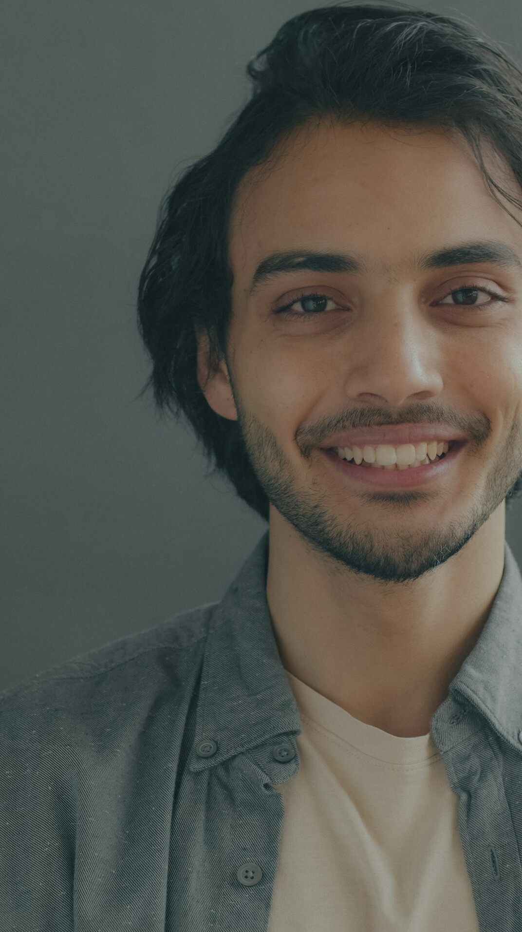 Studio portrait of a young man specialist smiling